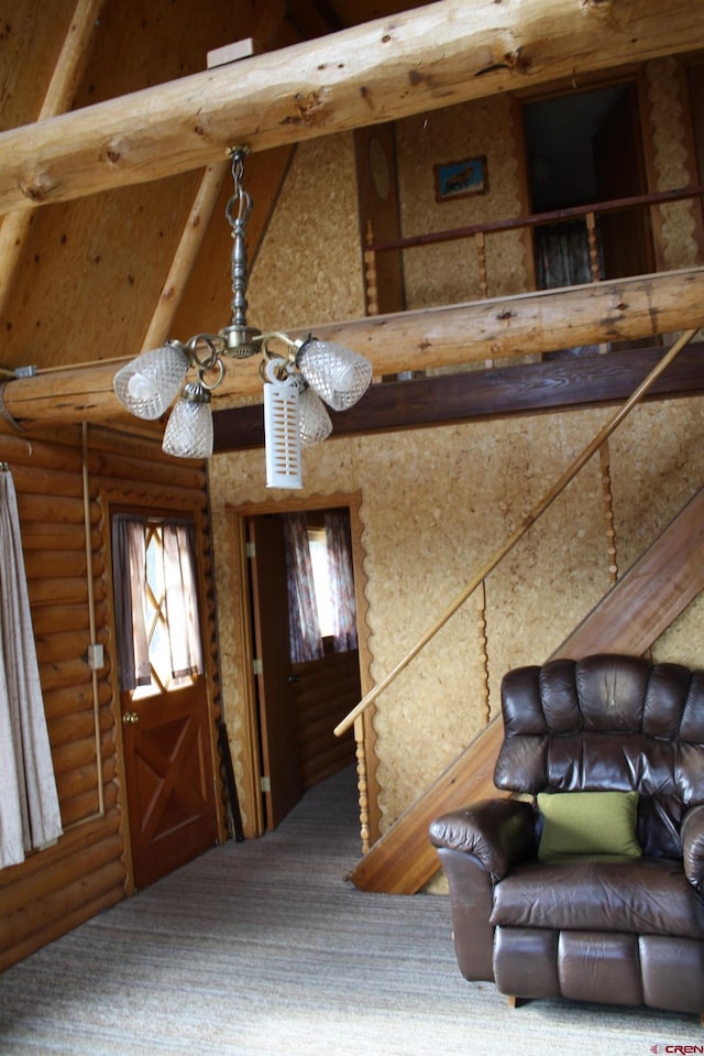 entrance foyer with vaulted ceiling with beams