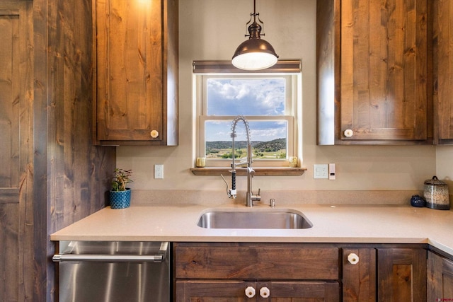 kitchen with decorative light fixtures and sink