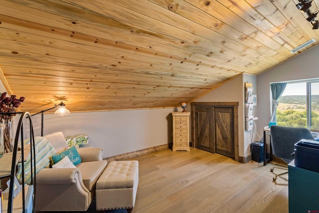 sitting room with lofted ceiling, wood ceiling, and light wood-type flooring