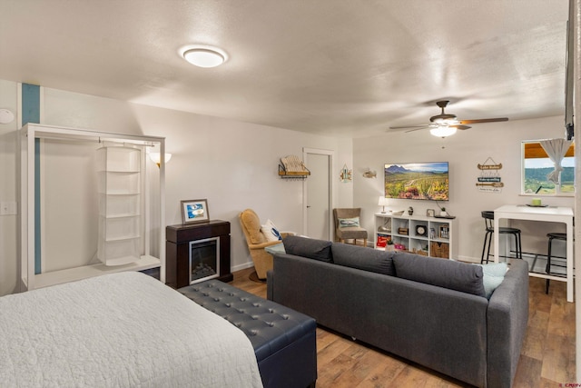 bedroom with wood-type flooring and ceiling fan