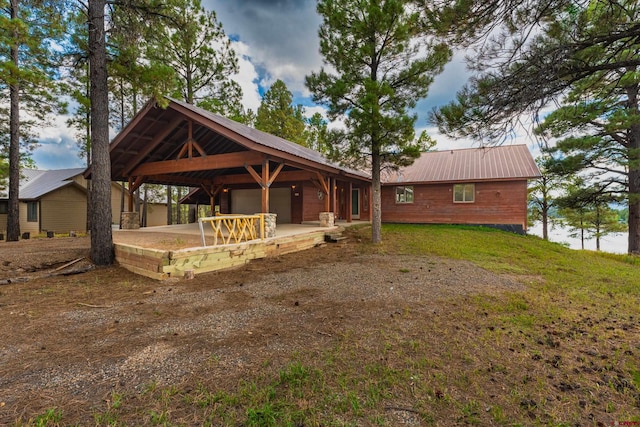 rear view of property featuring a patio area