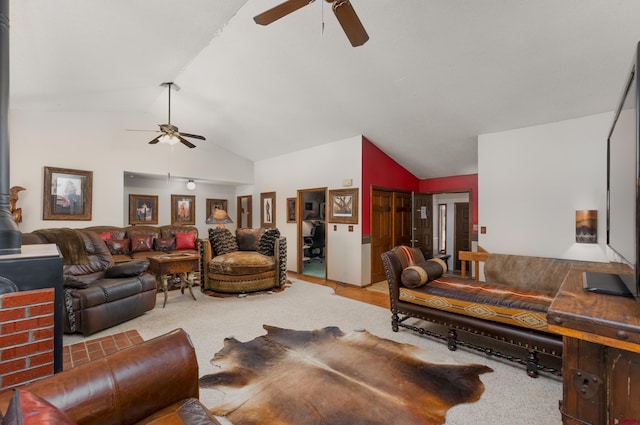 carpeted living room with lofted ceiling and ceiling fan