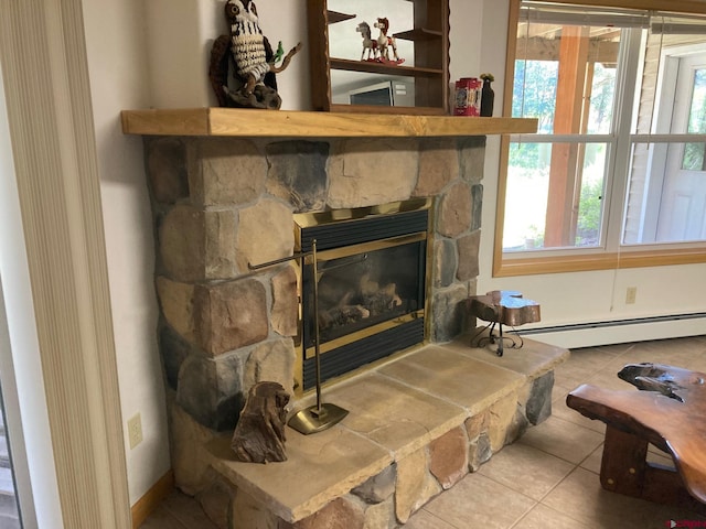 details featuring tile patterned flooring, a fireplace, and a baseboard radiator