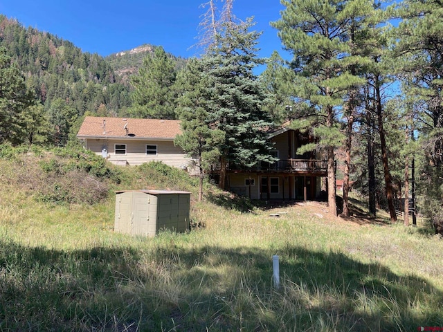 rear view of property featuring a mountain view