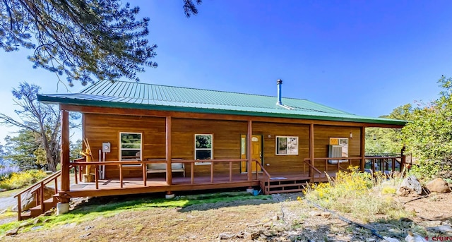 rear view of house with a deck