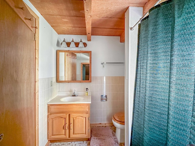 bathroom featuring tile walls, a shower with curtain, vanity, toilet, and tile patterned floors