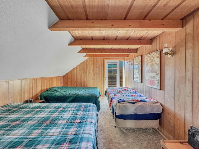 carpeted bedroom featuring lofted ceiling with beams, wooden walls, and wooden ceiling