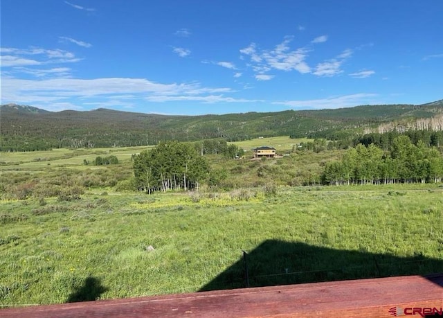 property view of mountains featuring a rural view