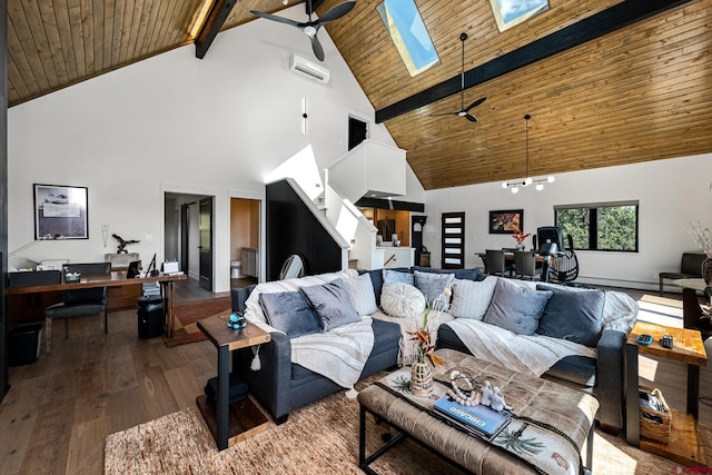 living room with ceiling fan, beamed ceiling, a skylight, high vaulted ceiling, and hardwood / wood-style floors