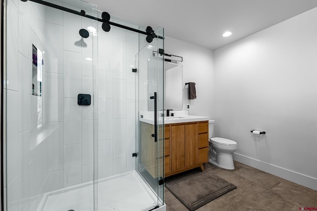 bathroom with vanity, toilet, and an enclosed shower