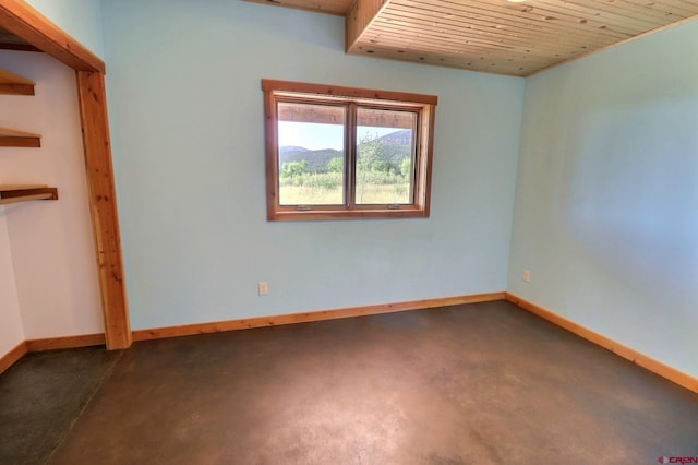 spare room featuring wood ceiling