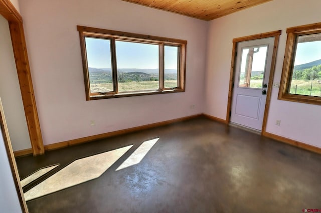 unfurnished room featuring wood ceiling