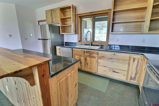 kitchen with appliances with stainless steel finishes and sink