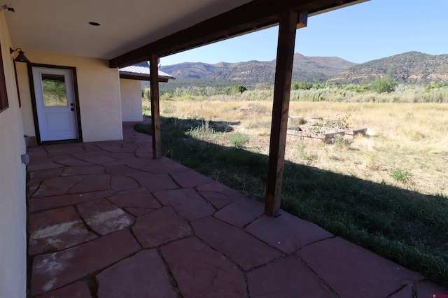 view of patio / terrace with a mountain view