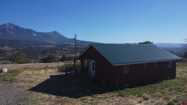 view of side of home with a mountain view