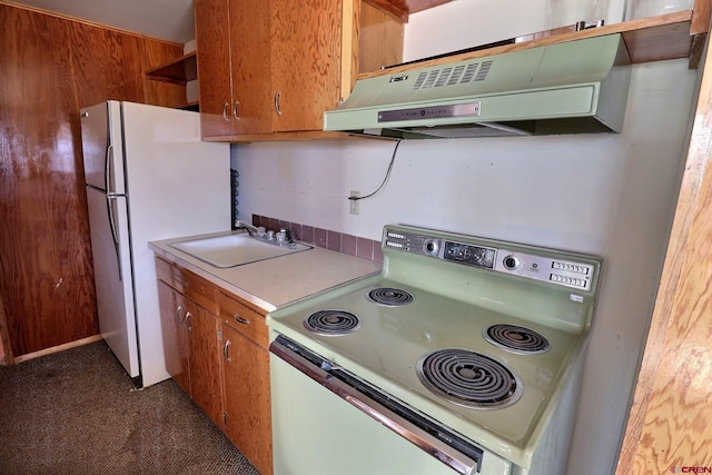 kitchen featuring sink and white appliances