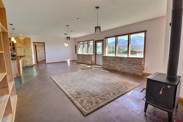 living room with a mountain view and a wood stove