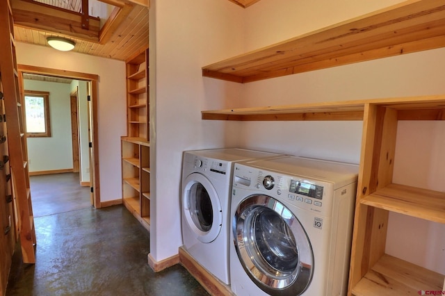 laundry area featuring wood ceiling and independent washer and dryer