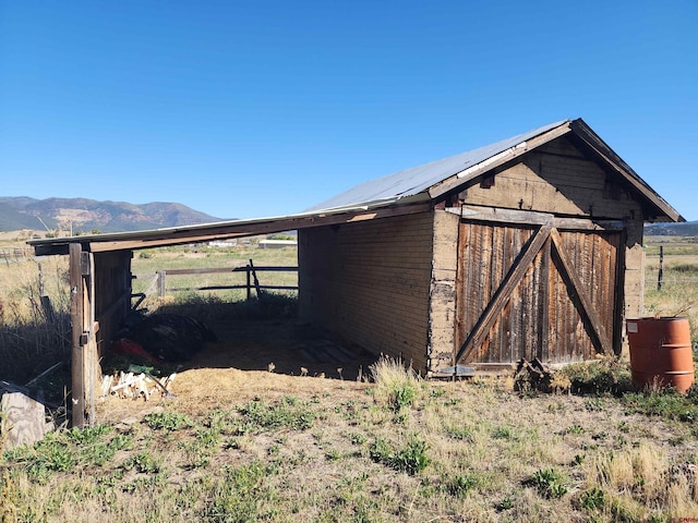 view of outdoor structure featuring a mountain view