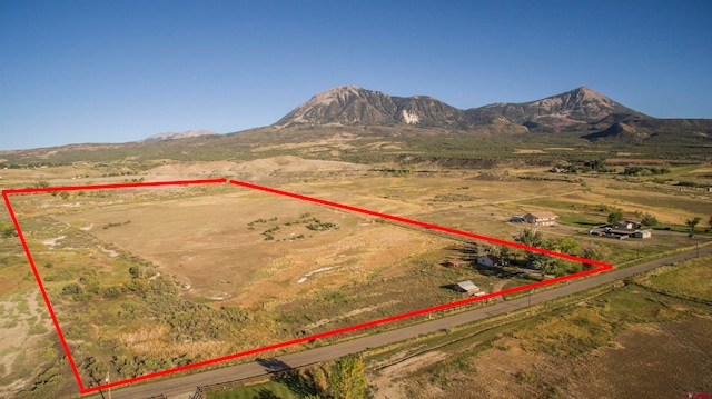 birds eye view of property featuring a rural view and a mountain view