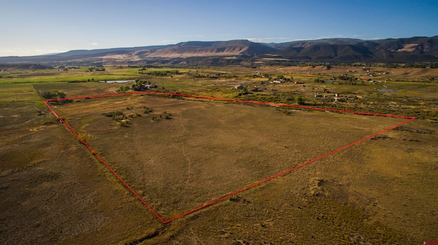 bird's eye view with a mountain view and a rural view