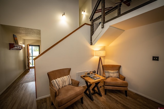 sitting room featuring dark hardwood / wood-style floors