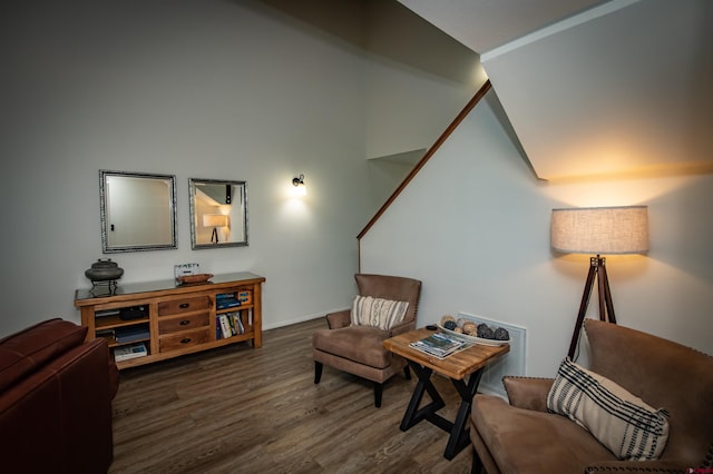 sitting room featuring vaulted ceiling and dark hardwood / wood-style floors