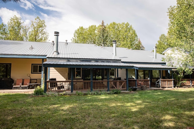 rear view of house with a lawn