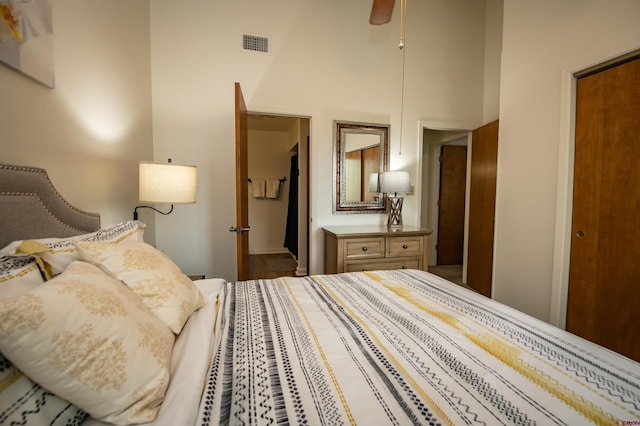 bedroom featuring a high ceiling and ceiling fan