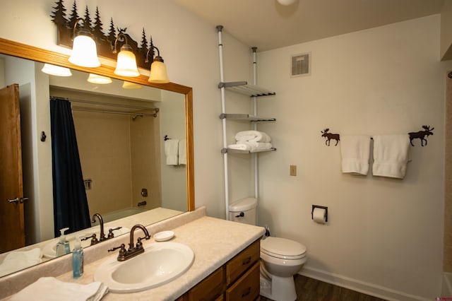 full bathroom featuring wood-type flooring, vanity, toilet, and shower / bath combo