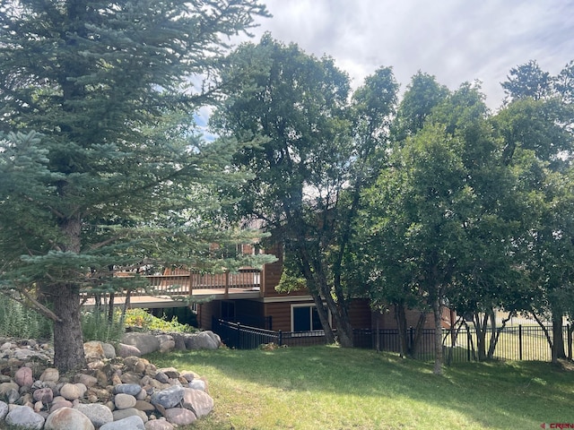 view of yard featuring a wooden deck