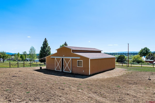 view of outbuilding with a rural view