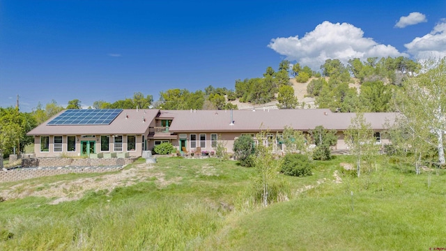 back of property with solar panels