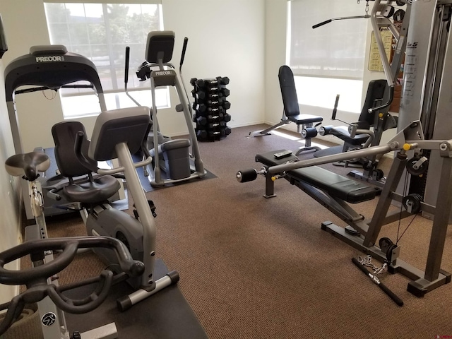 exercise room with baseboards