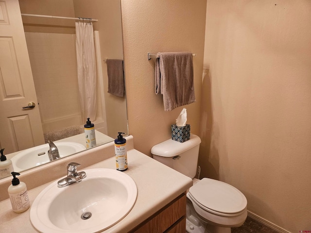 bathroom with vanity, toilet, and a shower with curtain