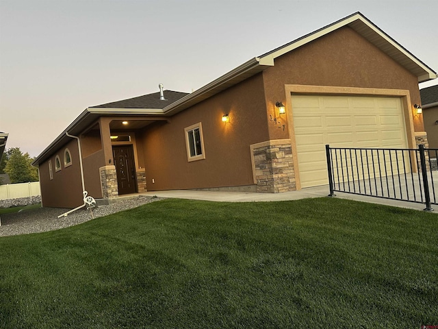 1427 Rainier Ln, Delta, CO 81416 - view of front of property with stone siding, stucco siding, and an attached garage