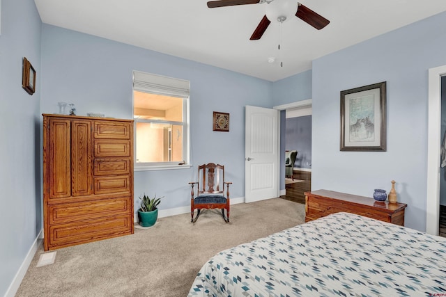 bedroom featuring light carpet and ceiling fan