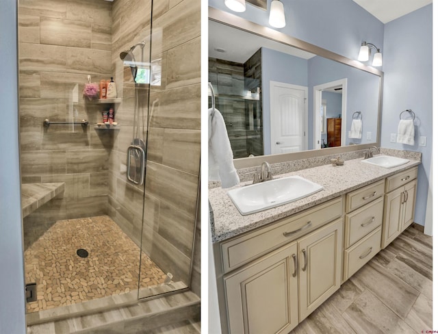 bathroom with an enclosed shower and vanity