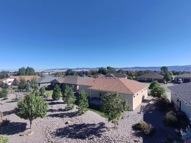 back of property featuring a mountain view and a patio area