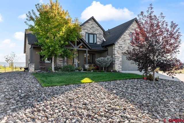 view of front of house with a garage and a front lawn