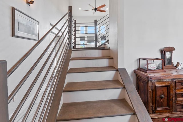 stairway with ceiling fan