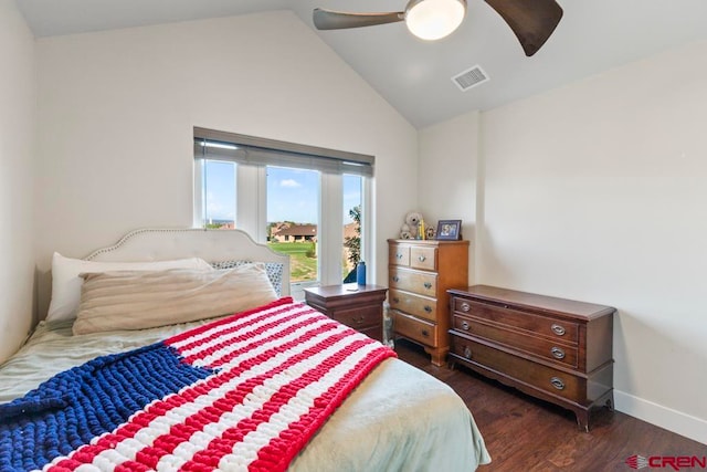 bedroom with vaulted ceiling, ceiling fan, and dark hardwood / wood-style flooring