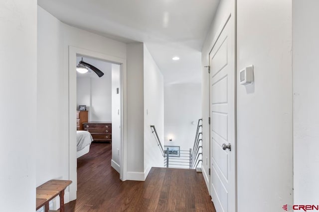 corridor with dark hardwood / wood-style floors