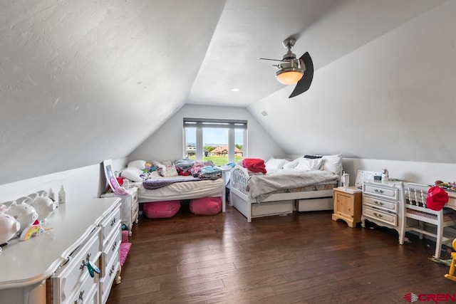 bedroom featuring ceiling fan, lofted ceiling, and dark hardwood / wood-style floors