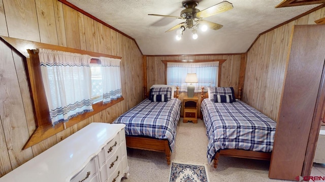 bedroom featuring ceiling fan, a textured ceiling, wood walls, and vaulted ceiling