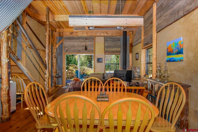 dining area featuring hardwood / wood-style flooring and wooden ceiling