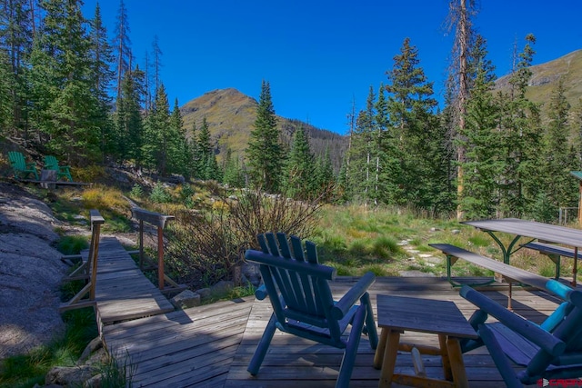 wooden deck with a mountain view