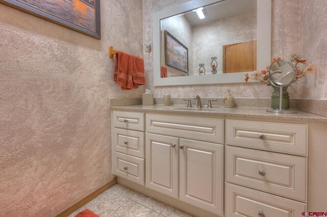 bathroom featuring tile patterned floors and vanity