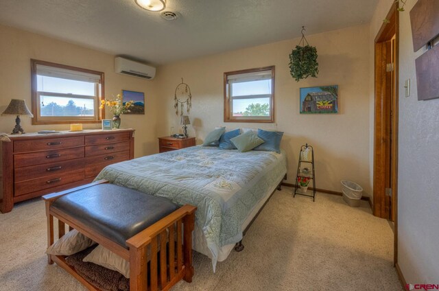 bedroom with light colored carpet and a wall mounted air conditioner