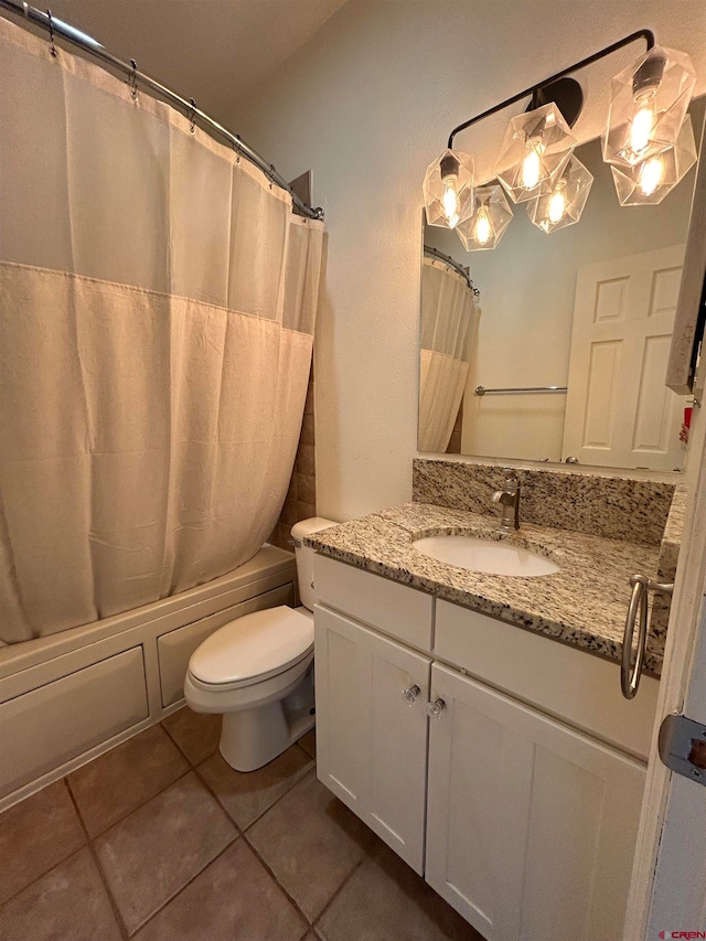 full bathroom featuring vanity, toilet, shower / bath combo with shower curtain, and tile patterned flooring